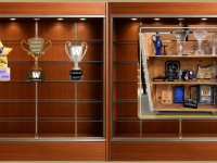 wood display cabinets showing a single image of a wood machine cart holding many kinds of trophies and three fake trophies calling out team funny sit next to the image