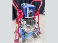 Blue and silver Hobart stand mixer, with attachments stored in the bowl.