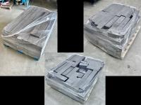 Three pallets full of black graphite blocks.