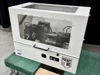 Pocket NC CNC machine in an enclosure.