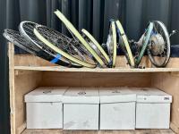 Two shelves full of bicycle parts.