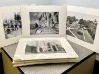 Group of black and white photos, printed and matted.