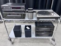 Stereo system components on a cart.