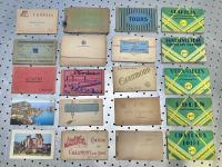 Colorful booklets of vintage postcards from various European destinations.