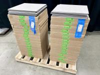 Cartons of LVT flooring stacked on a small pallet.