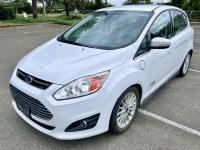 White 2016 Ford CMAX Energi plug-in hybrid car.