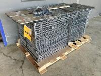 Pallet full of disassembled industrial wire racks.