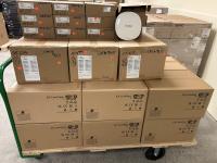 Boxes of Aruba wireless access points on a cart.