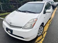 White 2009 Toyota Prius in a parking lot.