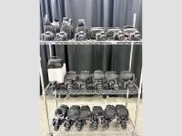 Cart with Canon DSLR cameras on the shelves.