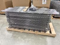 Pallet full of industrial wire shelving pieces.