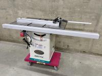 Grizzly table saw on a dolly in a warehouse.