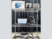Cart full of steady cams, gliders, teleprompters and other videopgraphy gear.