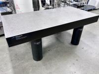 A large silver and black optical table.