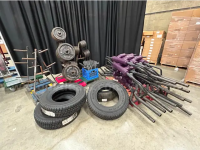Large group of gym weight lift equipment in a warehouse.